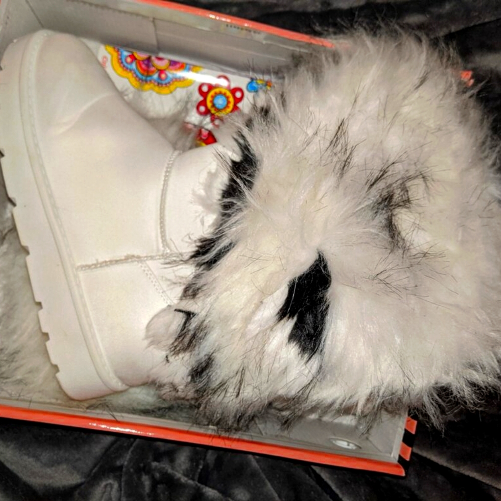 Solid white winter boots with black and white fuzz
